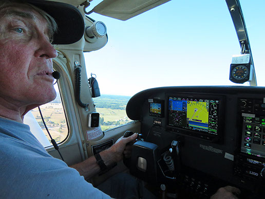 Michael Messmore pilots a small aircraft.